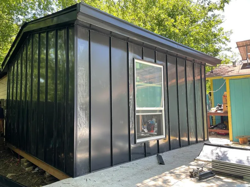 Black standing seam metal wall panels for Metal Roof Installation in Gun Plain